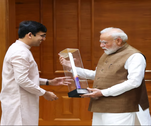 SES Company founder receiving award from PM Modi for satellite manufacturing excellence